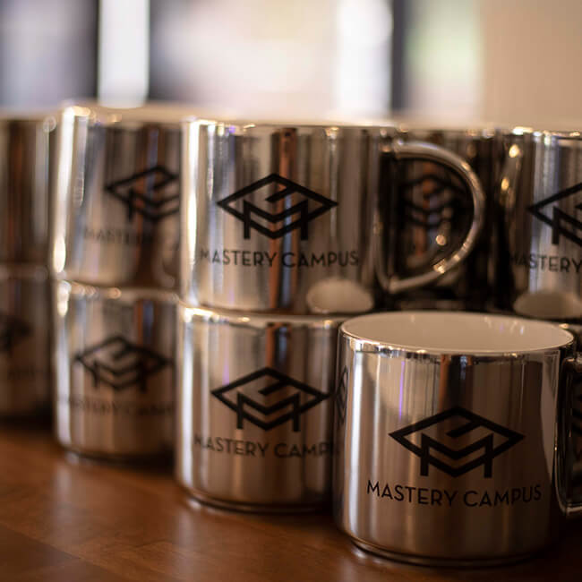 Close up shot of Mastery Campus Branded Mugs